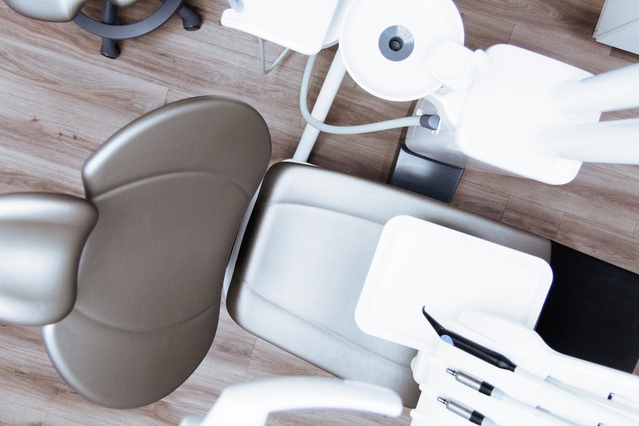 High-angle view of a modern dental chair and equipment setup in a professional clinic.